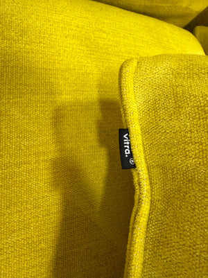 Gebrauchtes gelbes Vitra Mariposa Designer Stoff Sofa vor einer Wand, stilvoll und modern eingerichtet.