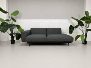 Gebrauchtes graues Muuto In Situ Designer Stoff Sofa vor einer Wand, stilvoll und modern eingerichtet.