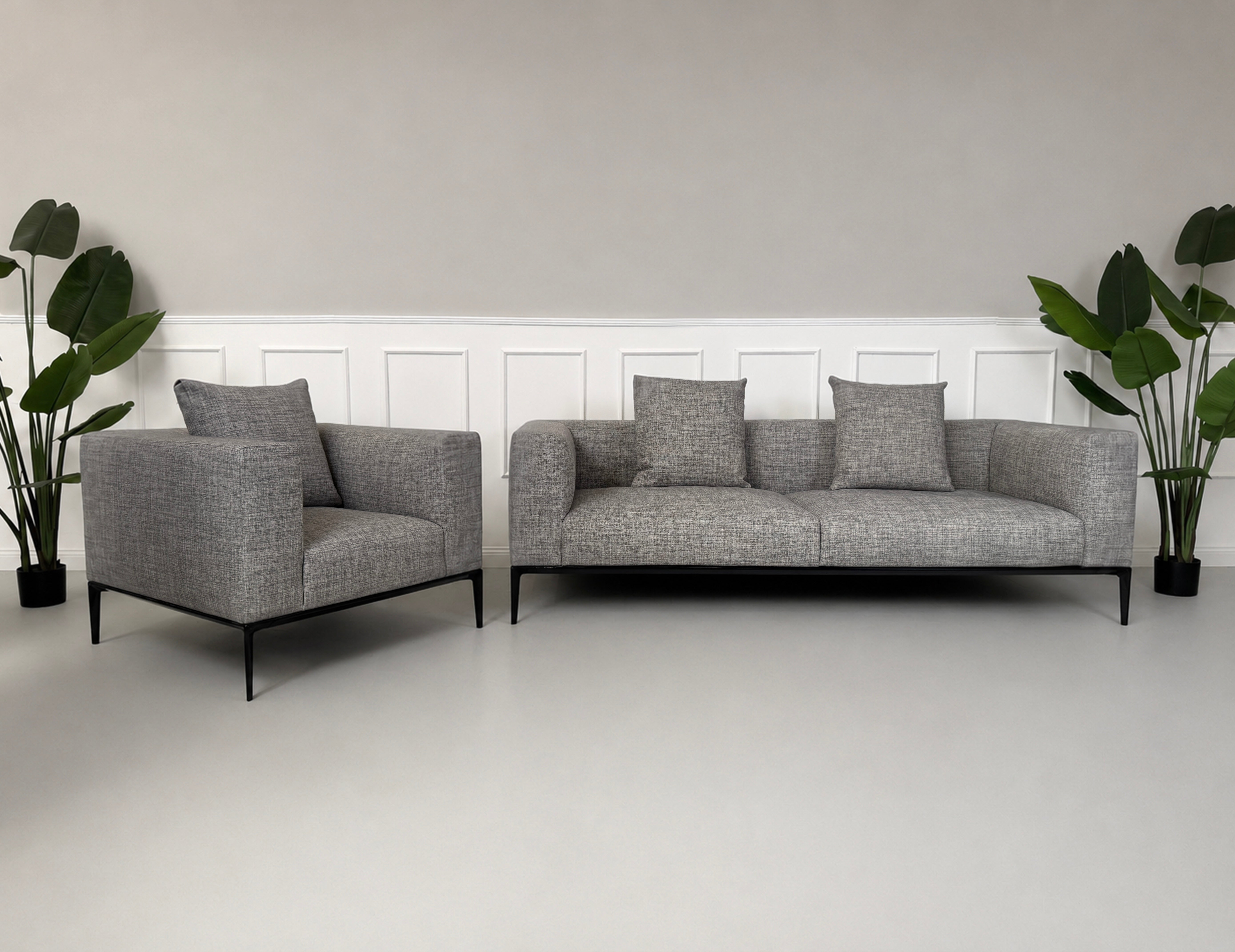 Gebrauchtes graues Walter Knoll Jaan Living Designer Stoff Sofa vor einer Wand, stilvoll und modern eingerichtet.