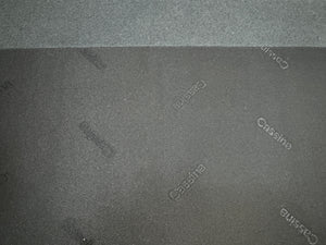 Gebrauchtes graues Cassina Toot Designer Stoff Sofa vor einer Wand, stilvoll und modern eingerichtet.